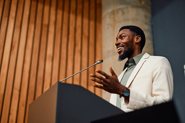 istock Motivational speaker inspiring audience with his speech during a conference 2217360186