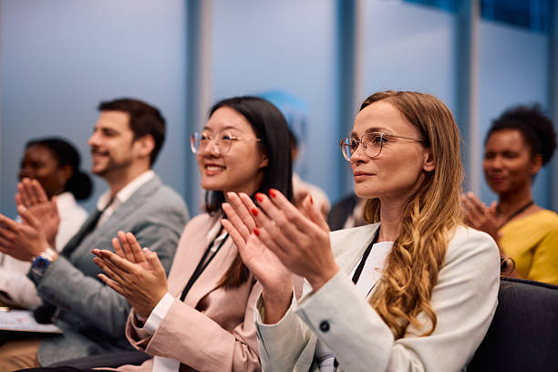 istock Business People Clapping at Conference Appreciating Inspiring Speaker 2217360187