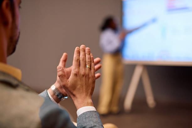 istock Businessman clapping hands after successful presentation in modern office 2217360219