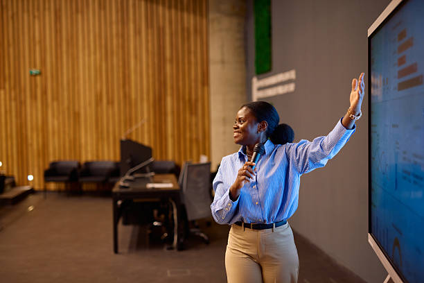 istock Motivated black businesswoman presenting her project using a digital whiteboard 2217360227