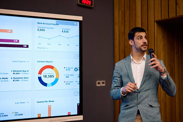 istock Businessman presenting sales report using a digital screen during a conference 2217360295
