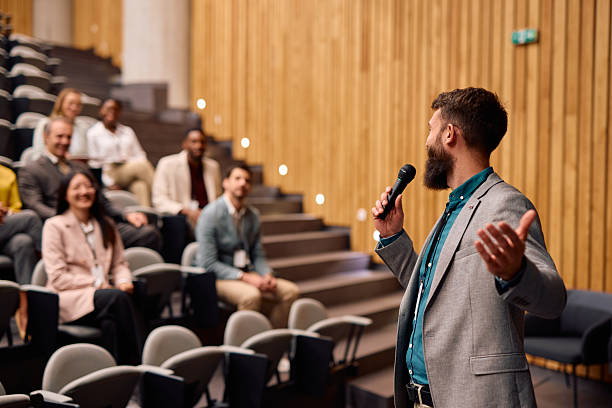 istock Motivational speaker inspiring audience during a business conference 2217360319