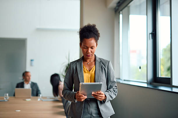 istock Confident businesswoman using digital tablet in modern office 2217360500