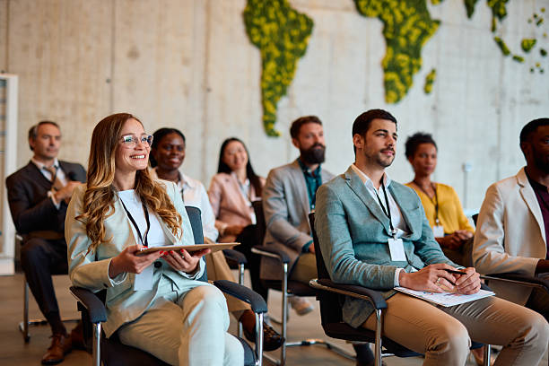 istock Businesspeople attending a seminar in convention center 2217360625