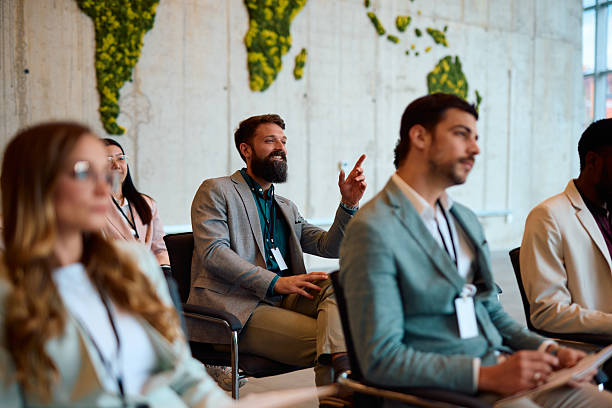 istock Businessman asking a question during a conference meeting 2217360780