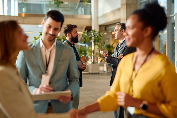 istock Business people networking and talking during a corporate event in a modern office building 2217361078