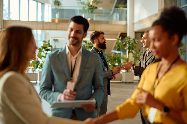 istock Business people networking and shaking hands at a conference 2217361100