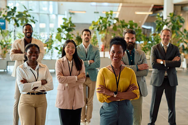 istock Diverse business team smiling with arms crossed in modern office 2217361233