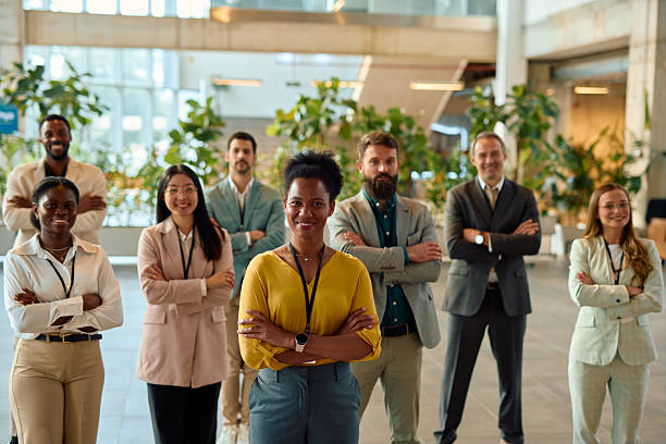 istock Diverse business team smiling with arms crossed in modern office 2217361235