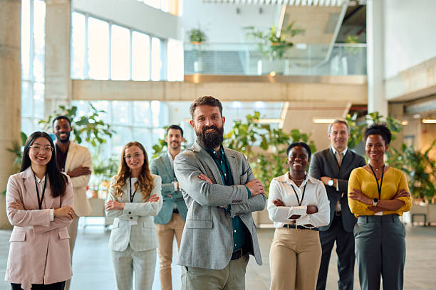 istock Confident business team smiling with arms crossed in modern office 2217361289