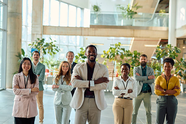 istock Diverse business team smiling with arms crossed in modern office 2217361328