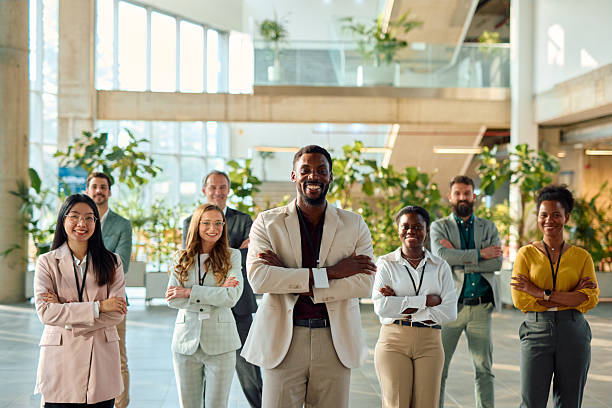 istock Diverse business team smiling with arms crossed in modern office 2217361336