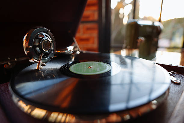 Close-up of a cartridge head on a vinyl record, analog retro music, vinyl disc collecting, vintage equipment