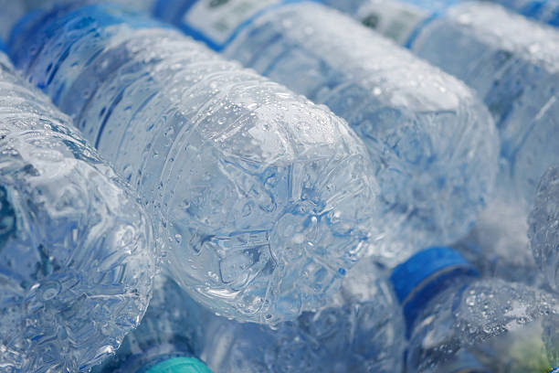istock Clear water bottles stacked together in a modern setting 2217363889