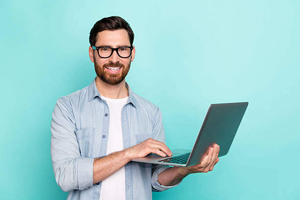 istock Photo of professional marketer guy use netbook typing colleagues start-up information isolated cyan color background 2217365881