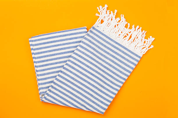 istock Folded blue beach towel on color background,top view 2217370332