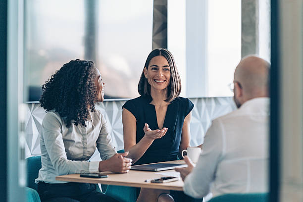 istock View through an open office door to a business team having a conversation 2217371275