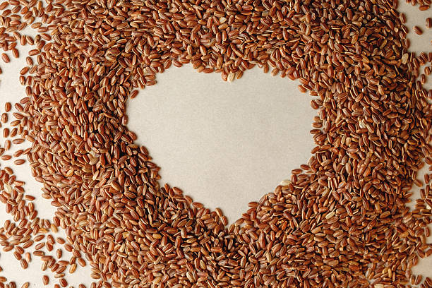 istock Heart-shaped brown rice on a soft surface showcasing love for nature 2217371971