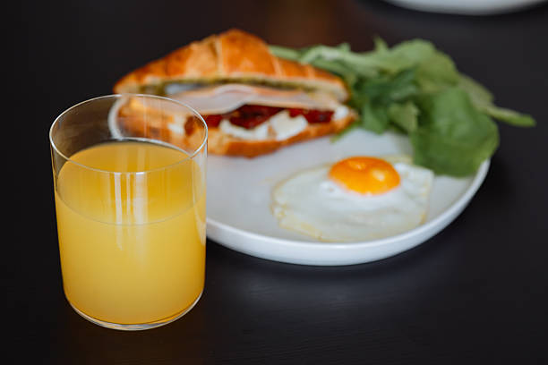 Home made freshness bacon,fried egg with avocado ,tomato and rocket leaves on fried soda bread