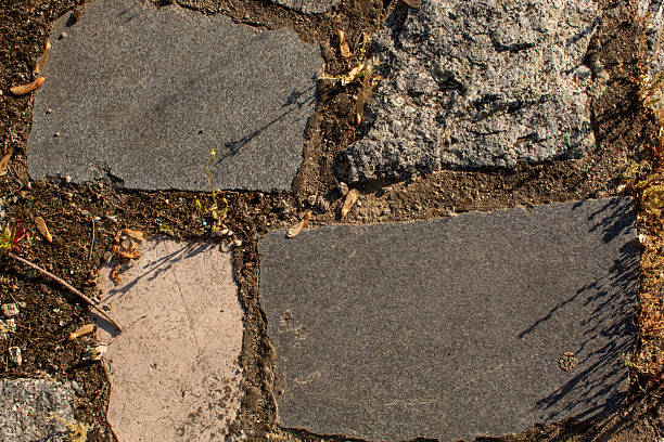 Stone cubes with concrete on the ground. Flat lay