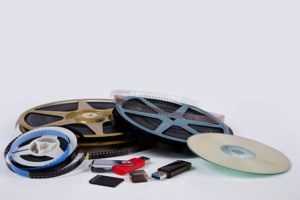 The old recorder cartridge, the USB stick, and compact disks lie in a frame from the confused cassette tape.