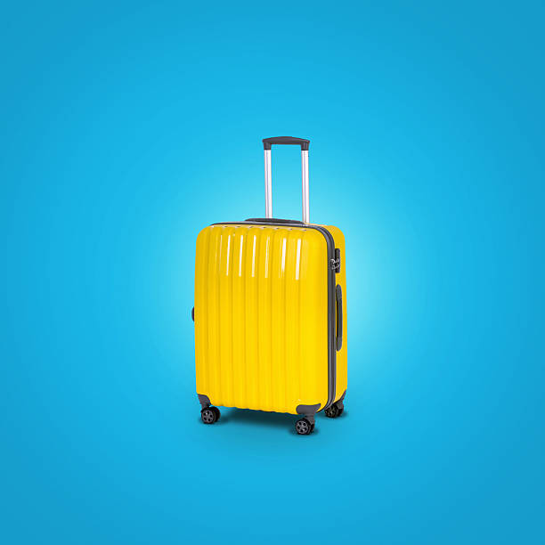 istock Yellow suitcase on a blue background. Trip concept 2217375234
