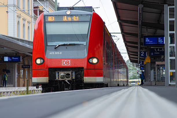 Friedrichshafen, Baden Wurttenberg, Germany, May 21st, 2024. Red DB regional train approaching the platform at a German train station Friedrichshafen Hafen.