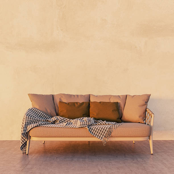 A cozy designed sofa seat with colorful pillow set at hotel lobby. Interior furniture and decoration object.