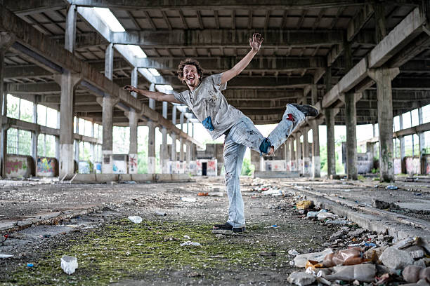 Creative human performance in a vast, derelict industrial facility. The unique combination of motion and urban decay evokes themes of resilience, creativity, and discovery.