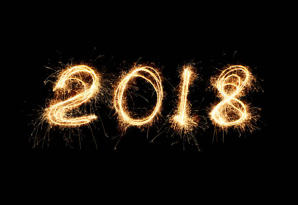 istock New year 2018 light. Sparklers draw figures 2018. Bengal lights and letter 2217379568