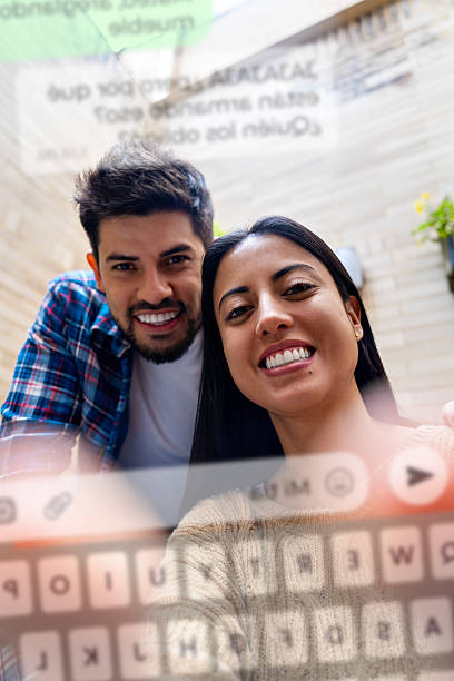 Happy Couple Chatting on Smartphone – Messaging App POV