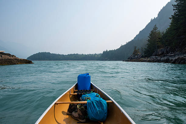 View past canoe bow to ocean and mountains, Howe Sound, Pacific West Coast, B.C.