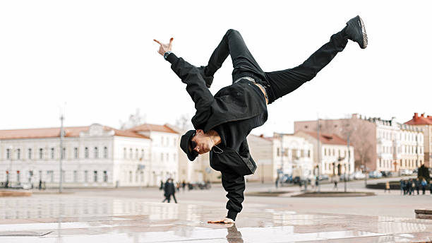 istock Handsome young dancer male dancer performs in the city 2217380129
