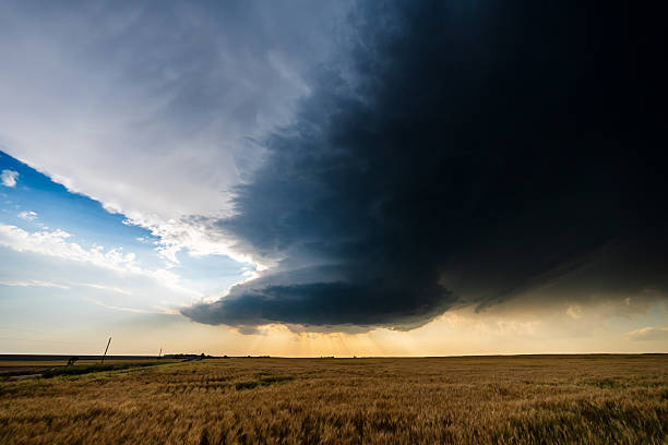 istock Epic scene as incredible supercell storm darkens the sky at sunset 2217382336