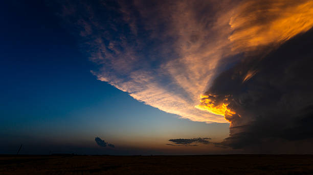 istock Sunset light fill towering storm clouds with incredible color and contrast 2217382348