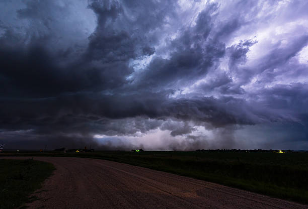 istock Lightning flashes light up huge ominous storm cloud 2217382404