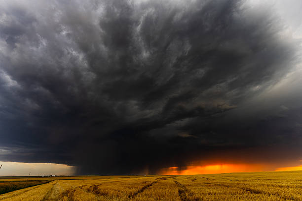istock Severe ominous storm gust front approaching as the sun sets 2217383087