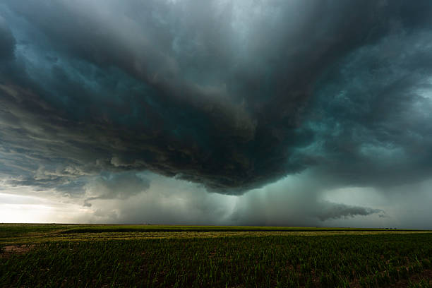 istock Rainstorm fills the sky as powerful dark storm clouds loom 2217383100