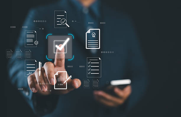 istock Businessman touching approved document icon on digital documents for approve business project proposals. Quality assurance and online evaluation of business concept. 2217383115