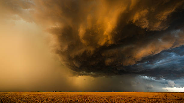 istock Texture and contrast filled storm clouds bursting with low angle sun light color 2217383130