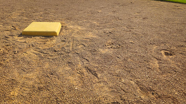 istock view of a baseball or softball base on a sunny day with space for copy 2217384818