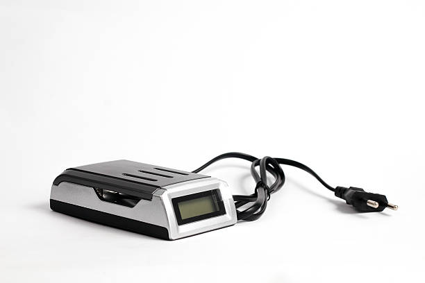 battery charger AA attached black cable isolated white background.