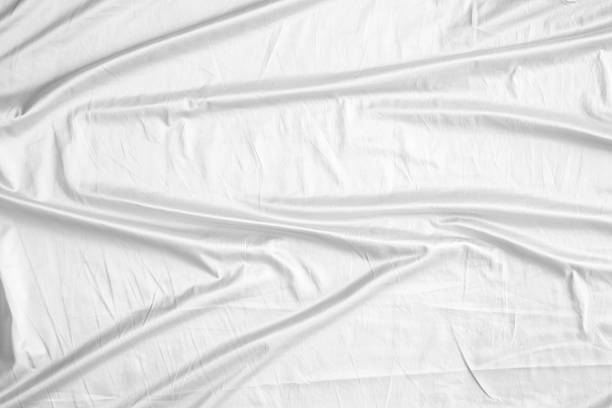 istock Abstract white wrinkled bedding sheet fabric texture background 2217387809