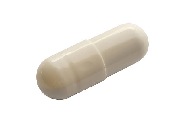 istock White medicine pill capsule isolated on white background 2217387881