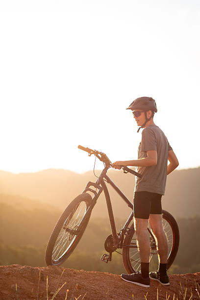 istock Cyclist on a Dirt Trail at Golden Hour 2217391107
