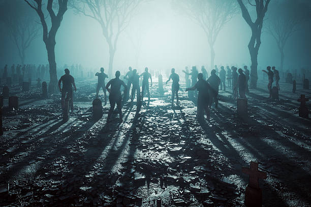 istock Zombies in the graveyard at night 2217391121