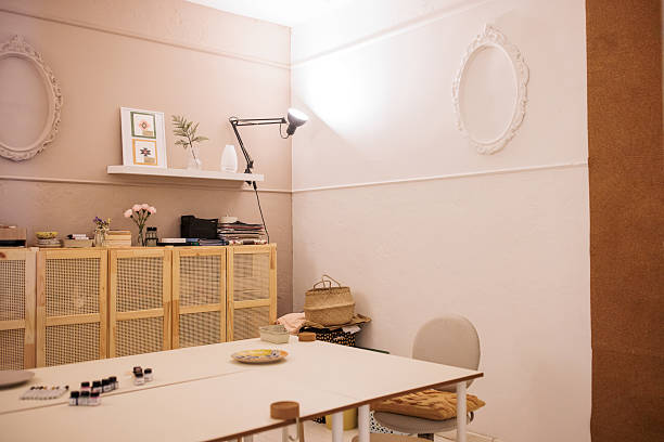 istock Creative Workshop Table with Ceramic Plates and Painting Supplies 2217391244