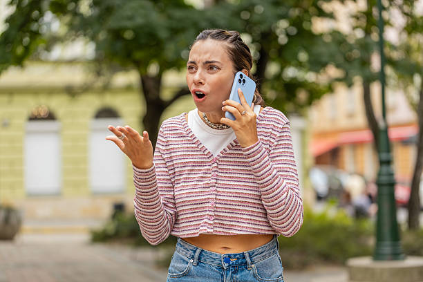 istock Angry mad stressed woman arguing while talking on smartphone conversation irritated shout quarrel 2217395127
