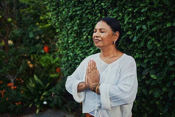 istock Peaceful Mature Woman Practicing Meditation Outdoors 2217395835
