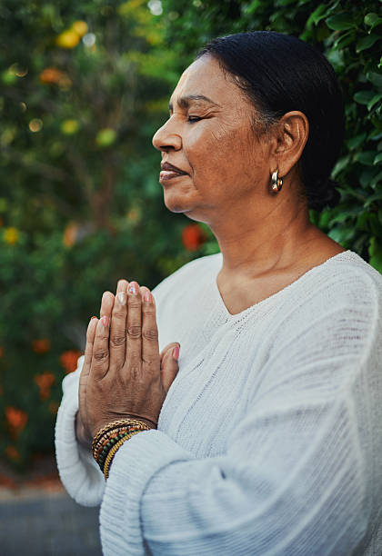 istock Peaceful Mature Woman Practicing Meditation Outdoors 2217395840
